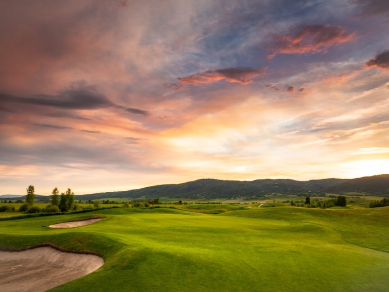 Golf hole at sunrise